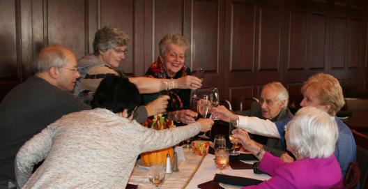 Faculty and friends toast Dr. McGinnis