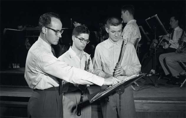 Donald McGinnis instructs Concert Band students, 1955.